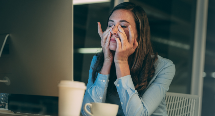 woman stressed with hands on face