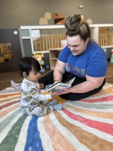 daycare provider reading to baby